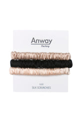 3er-Set Seiden-Scrunchies in den Farben Incarnadine, Schwarz und Baby Pink – schonender Haargummi aus 100 % Seide für sanften Halt ohne Haarbruch.