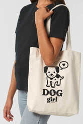 Naturfarbene Tote Bag mit schwarzem Motiv „DOG girl“ – süsser gezeichneter Hund mit Herz-Sprechblase – ideal für Hundefans, grosse Stofftasche aus 80% recycelter Baumwolle und 20% recyceltem Polyester.