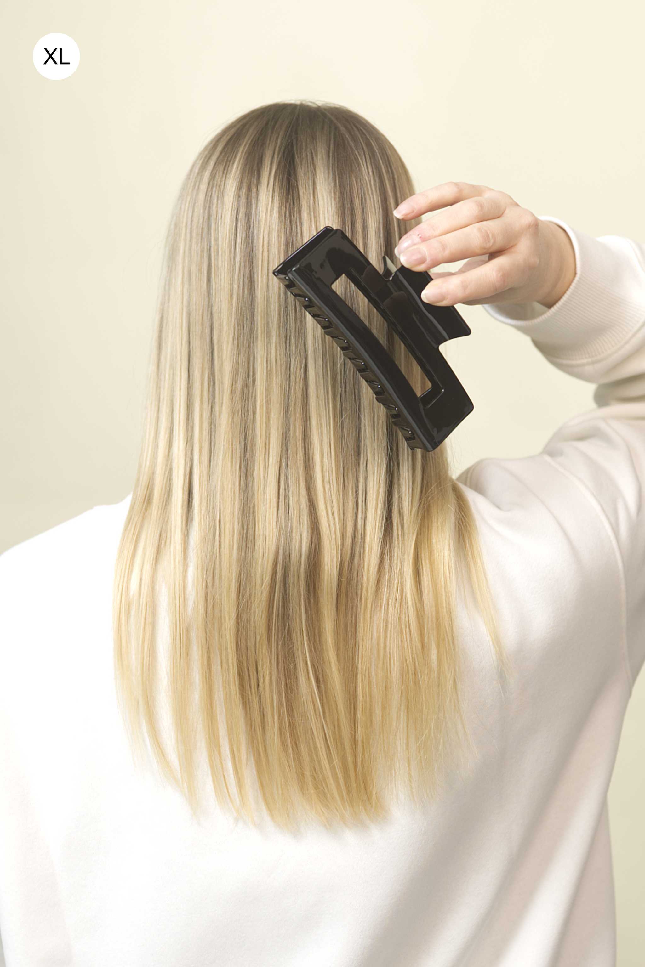 Stilvolle Haarklammer in schwarz aus robustem und leichtem Material – modisches Haaraccessoire mit sicherem Halt und angenehmem Tragegefühl, ideal für den Alltag und besondere Anlässe.