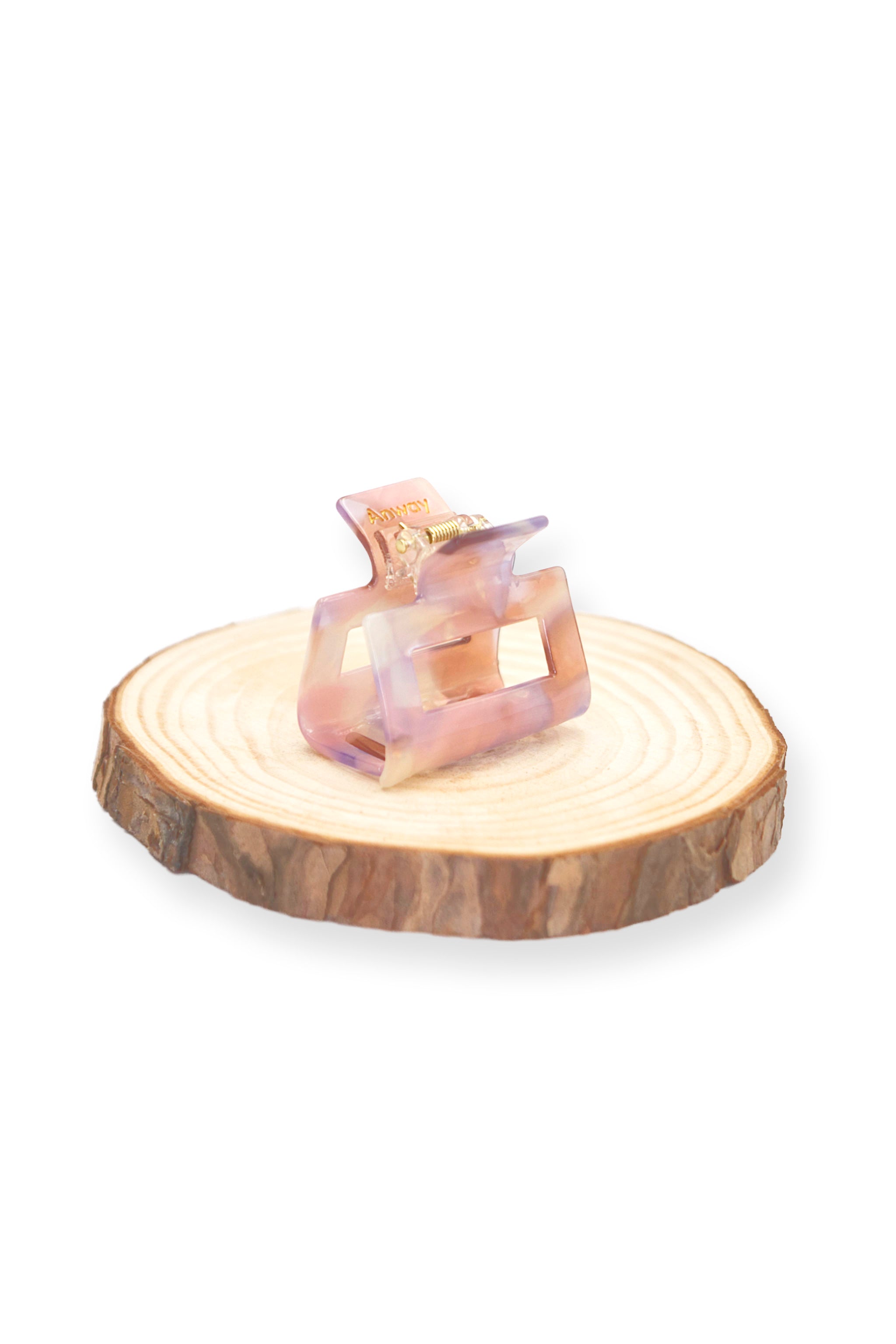 Kompakte Square Haarklammer in marmoriertem Rosa, Beige, Flieder, perlendem Weiss mit elegantem Design – stilvolles, langlebiges und praktisches Haaraccessoire für unterwegs, das idealen Halt und maximalen Komfort bietet.