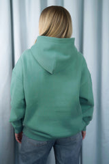 TURQUOISE GREEN Unisex Hoodie mit moderner, oversized Passform – kuschlig weich und aus hochwertigem Material.