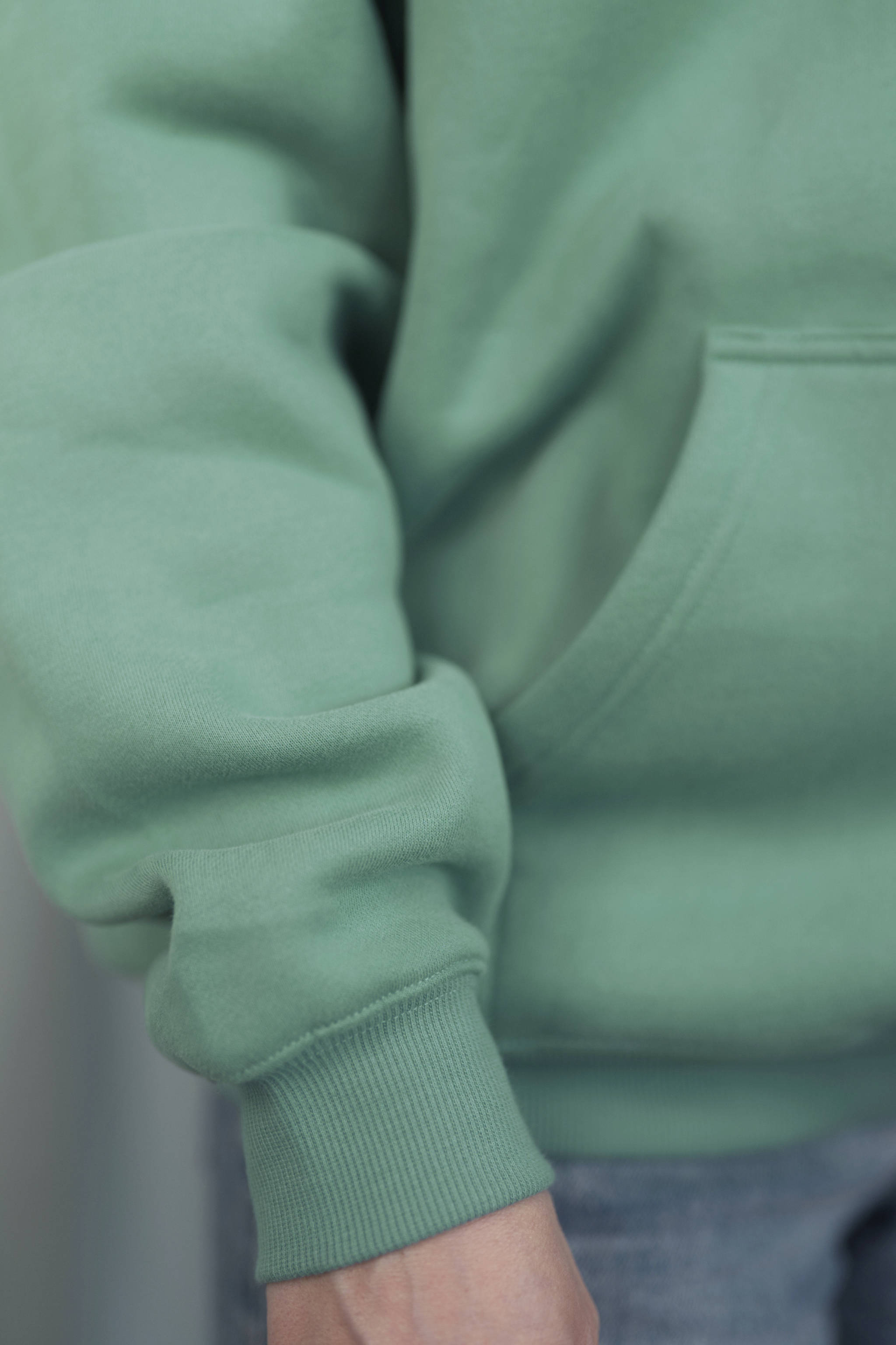 TURQUOISE GREEN Unisex Hoodie mit moderner, oversized Passform – kuschlig weich und aus hochwertigem Material.