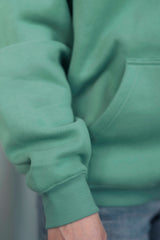 TURQUOISE GREEN Unisex Hoodie mit moderner, oversized Passform – kuschlig weich und aus hochwertigem Material.