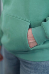 TURQUOISE GREEN Unisex Hoodie mit moderner, oversized Passform – kuschlig weich und aus hochwertigem Material.