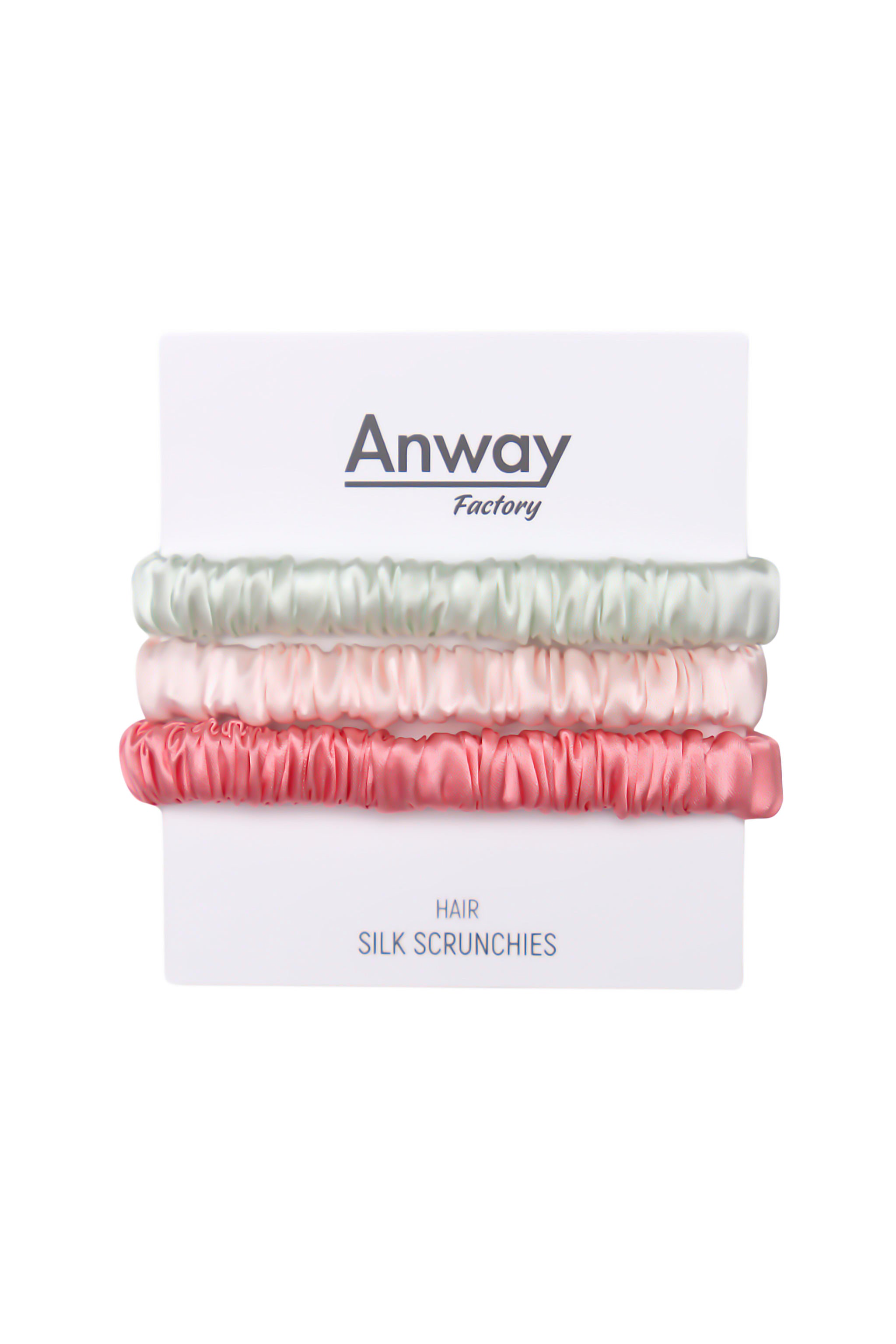 3er-Set Seiden-Scrunchies in den Farben Light Green, Pink und Peach – schonender Haargummi aus 100 % Seide für sanften Halt ohne Haarbruch.
