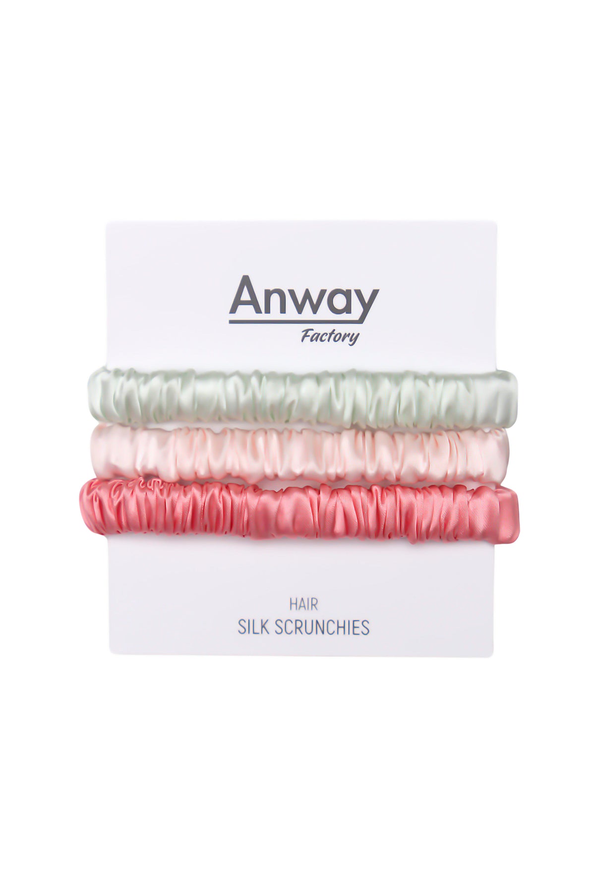 3er-Set Seiden-Scrunchies in den Farben Light Green, Pink und Peach – schonender Haargummi aus 100 % Seide für sanften Halt ohne Haarbruch.