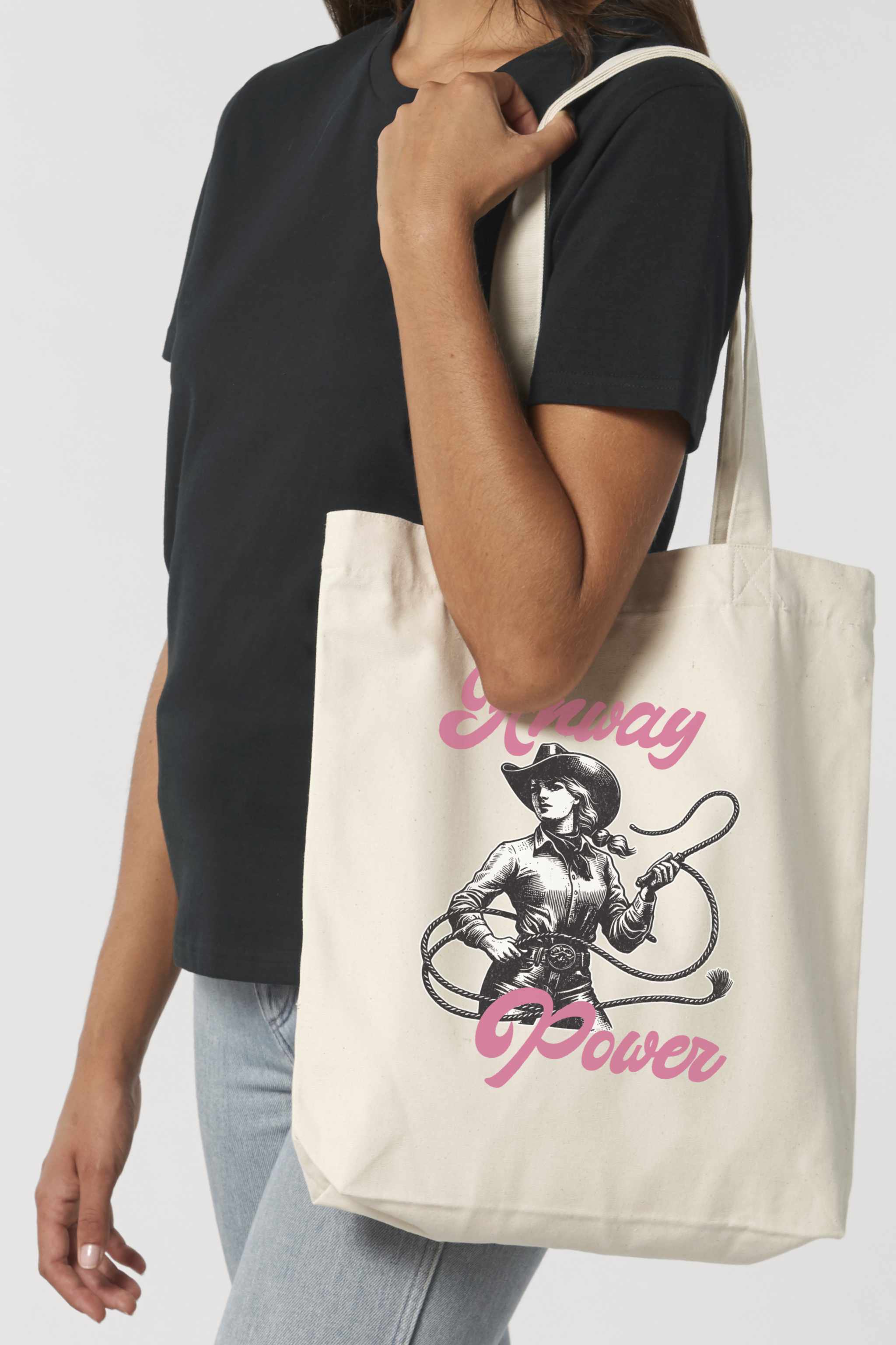 Naturfarbene Tote Bag mit starkem Retro-Cowgirl-Motiv in Schwarz-Weiss und pinkem Schriftzug „Anway Power“ – eine stylische Stofftasche mit femininer Energie und Statement-Charakter.