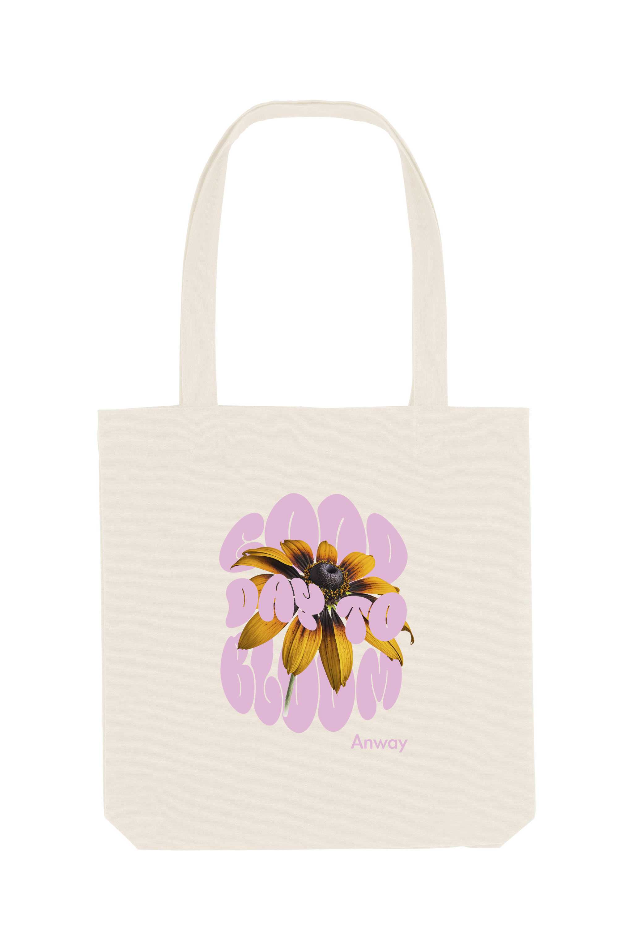 Naturfarbene Tote Bag mit dem rosa Schriftzug „GOOD DAY TO BLOOM“ im Retro-Stil, durchzogen von einer leuchtend gelben Sonnenblume – florales Statement-Piece mit positiver Botschaft.