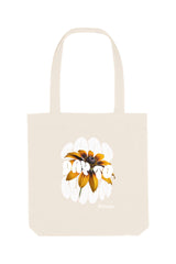 Naturfarbene Tote Bag mit dem weissem Schriftzug „GOOD DAY TO BLOOM“ im Retro-Stil, durchzogen von einer leuchtend gelben Sonnenblume – florales Statement-Piece mit positiver Botschaft.